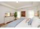 Bright bedroom with hardwood floors and large windows at 405 Laurel Spring Ct, Canton, GA 30114
