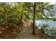 Scenic nature trail winds along a tranquil lake at 405 Laurel Spring Ct, Canton, GA 30114