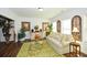 Light and airy sitting room with a sofa and decorative accents at 405 Laurel Spring Ct, Canton, GA 30114