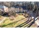 An aerial shot showcasing the home's landscaping, mature trees, and neighborhood at 4116 River Cliff Chase Se, Marietta, GA 30067