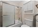 Full bathroom with a shower-tub, toilet, and a storage cabinet at 4116 River Cliff Chase Se, Marietta, GA 30067