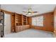 Bedroom with built-in bookshelves, a ceiling fan, and a view to the outside at 4116 River Cliff Chase Se, Marietta, GA 30067