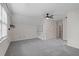 Spacious bedroom with new gray carpet, a modern ceiling fan, and ample natural light at 4116 River Cliff Chase Se, Marietta, GA 30067