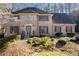 Charming two-story brick home featuring a landscaped front yard and traditional architectural details at 4116 River Cliff Chase Se, Marietta, GA 30067