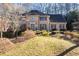 Two-story brick home with a well-manicured lawn and mature landscaping at 4116 River Cliff Chase Se, Marietta, GA 30067