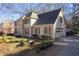 Beautiful brick home featuring a side-entry garage and professionally landscaped front yard, perfect for families at 4116 River Cliff Chase Se, Marietta, GA 30067