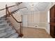 Grand foyer featuring hardwood floors, staircase, and a decorative chandelier, making a great first impression at 4116 River Cliff Chase Se, Marietta, GA 30067