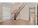Spacious foyer with a staircase, neutral walls, and doorways to other rooms at 4116 River Cliff Chase Se, Marietta, GA 30067