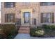 Front entrance with brick steps, black railings, and a decorative front door at 4116 River Cliff Chase Se, Marietta, GA 30067