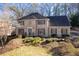 Traditional two-story brick home with shuttered windows and manicured front yard at 4116 River Cliff Chase Se, Marietta, GA 30067