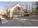 Attached two-car garage with long driveway and mature landscaping at 4116 River Cliff Chase Se, Marietta, GA 30067