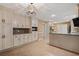 Kitchen featuring granite countertops, white cabinetry, stainless steel appliances, and an open design at 4116 River Cliff Chase Se, Marietta, GA 30067