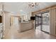 An open-concept kitchen with a large island, stainless steel appliances, and access to an enclosed sun room at 4116 River Cliff Chase Se, Marietta, GA 30067