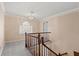This landing features natural light, a staircase and a decorative chandelier, creating an elegant feel at 4116 River Cliff Chase Se, Marietta, GA 30067