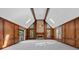 Spacious living room with soaring vaulted ceilings, wood paneling, fireplace, and large windows at 4116 River Cliff Chase Se, Marietta, GA 30067