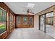Enclosed sunroom with brick walls, tile flooring, and numerous windows offering natural light at 4116 River Cliff Chase Se, Marietta, GA 30067