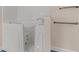 Close-up of an accessible walk-in bathtub featuring safety grab bars and white subway tile surround at 4116 River Cliff Chase Se, Marietta, GA 30067