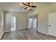 Spacious bedroom with ceiling fan and access to bathroom at 1428 Brandon Sq, Lawrenceville, GA 30044