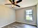 Well-lit bedroom with ceiling fan and large window at 1428 Brandon Sq, Lawrenceville, GA 30044