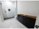 Modern bathroom featuring a spacious glass shower with black accents and stylish vanity, offering both comfort and sophistication at 4238 Paces Ferry Se Rd, Atlanta, GA 30339