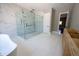 A luxurious bathroom boasting a large glass shower with multiple jets and a standalone tub for a spa-like experience at 4238 Paces Ferry Se Rd, Atlanta, GA 30339