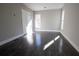 Inviting bedroom with hardwood floors, a bright window, and neutral walls, perfect for creating a personalized and relaxing space at 4238 Paces Ferry Se Rd, Atlanta, GA 30339