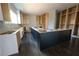 Unfinished kitchen with an island and custom-built cabinetry, awaiting your personal touches at 4238 Paces Ferry Se Rd, Atlanta, GA 30339