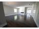 Bright living room with hardwood flooring, a modern fireplace, and large windows at 4238 Paces Ferry Se Rd, Atlanta, GA 30339