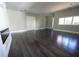 Open living space featuring hardwood floors, a modern fireplace, and bright natural light at 4238 Paces Ferry Se Rd, Atlanta, GA 30339