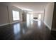 Spacious living room featuring hardwood floors, modern fireplace, and ample natural light, ideal for relaxation and entertaining at 4238 Paces Ferry Se Rd, Atlanta, GA 30339