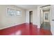 Bedroom with red floors, neutral walls, and closet at 4334 Greenleaf Sw Cir, Atlanta, GA 30331