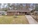Brick ranch house with a driveway and landscaped yard at 4334 Greenleaf Sw Cir, Atlanta, GA 30331
