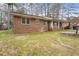 Brick ranch house with a carport and front yard at 4334 Greenleaf Sw Cir, Atlanta, GA 30331