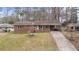 Brick ranch house with a driveway and landscaped yard at 4334 Greenleaf Sw Cir, Atlanta, GA 30331
