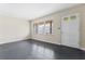 Living room with dark hardwood floors and large windows at 4334 Greenleaf Sw Cir, Atlanta, GA 30331