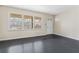 Living room with dark hardwood floors and large windows at 4334 Greenleaf Sw Cir, Atlanta, GA 30331