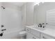 Elegant bathroom with white subway tile, sleek fixtures, and white vanity at 101 Forsyth Park Ln, Woodstock, GA 30188