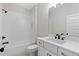 Modern bathroom with white subway tile, vanity with black fixtures, and clean design elements at 101 Forsyth Park Ln, Woodstock, GA 30188