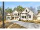 Beautiful new construction showcases traditional architecture with large windows and attractive neutral colors at 101 Forsyth Park Ln, Woodstock, GA 30188