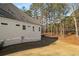 The side of this lovely home provides views of a lush wooded area at 101 Forsyth Park Ln, Woodstock, GA 30188