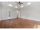 Spacious main bedroom boasts hardwood floors, tray ceiling, and ensuite bathroom at 101 Forsyth Park Ln, Woodstock, GA 30188