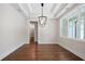 Bright office features a tray ceiling, dark hardwood floors, a window, and recessed lighting at 101 Forsyth Park Ln, Woodstock, GA 30188