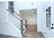 Inviting foyer with staircase and views of the dining room at 1020 Cottonwood Ln, Loganville, GA 30052