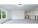 Open loft space with large window and access to hallway at 1020 Cottonwood Ln, Loganville, GA 30052