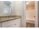 Updated bathroom with granite vanity and tiled shower/tub at 3144 Granada, Atlanta, GA 30344