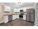 Renovated kitchen with granite countertops and stainless steel appliances at 3144 Granada, Atlanta, GA 30344