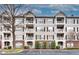 Three-story condominium building with brick and siding exterior and balconies at 4333 Dunwoody Park # 2113, Atlanta, GA 30338