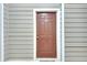 Exterior condo entry with a brown door and gray siding at 4333 Dunwoody Park # 2113, Dunwoody, GA 30338