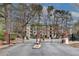 Gated entrance to the community with brick columns and landscaping at 4333 Dunwoody Park # 2113, Dunwoody, GA 30338