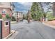 Gated entrance to the community with brick columns and landscaping at 4333 Dunwoody Park # 2113, Atlanta, GA 30338